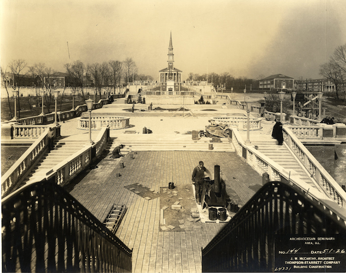 Workers put the finishing touches on the belvedere in this May 1926 photograph. The view is from the belvedere directly west to the mall and to the Chapel of the Immaculate Conception. (Photo courtesy: Joseph Cardinal Bernardin Archives and Records Center.)
